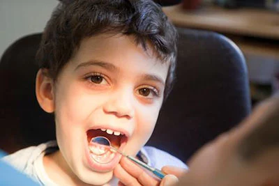 child receiving a dental checkup at Desert Sage Family Dental