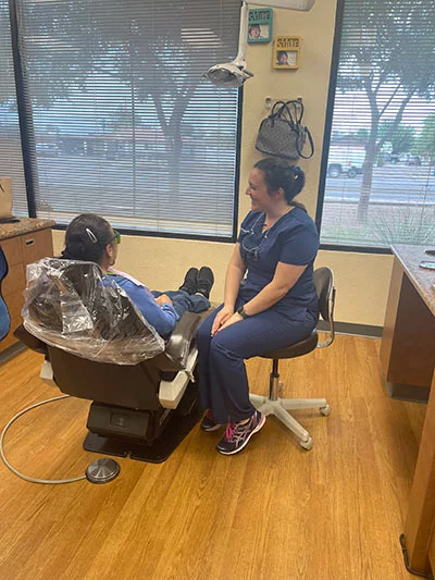 dentist talking with patient before a restorative dentistry procedure