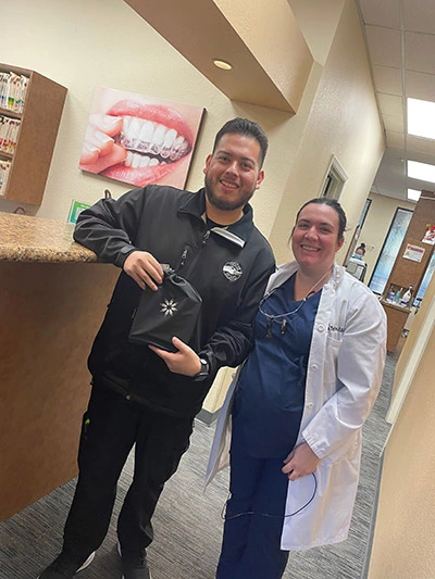the doctor at Desert Sage Family Dentistry with another satisfied Invisalign patient